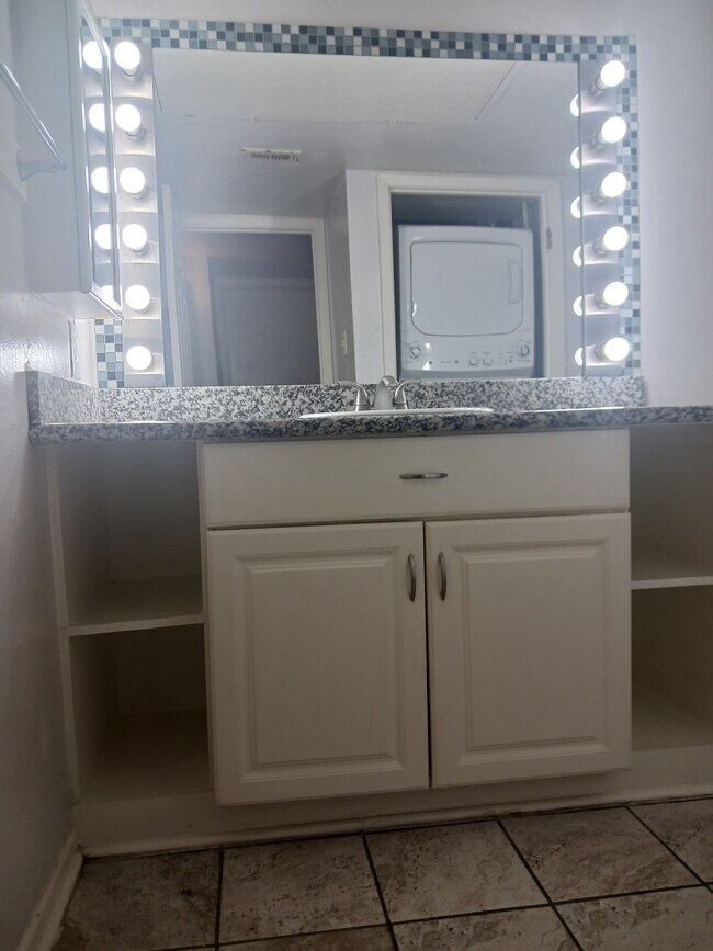 Bathroom vanity with increased storage space. Washer/Dryer pictured - 8435 Hearth Dr