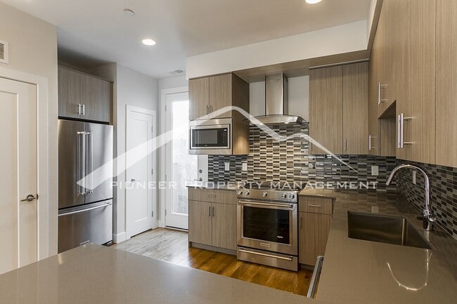 Building Photo - Georgeous Modern Condo with a Kitchen Fit ...