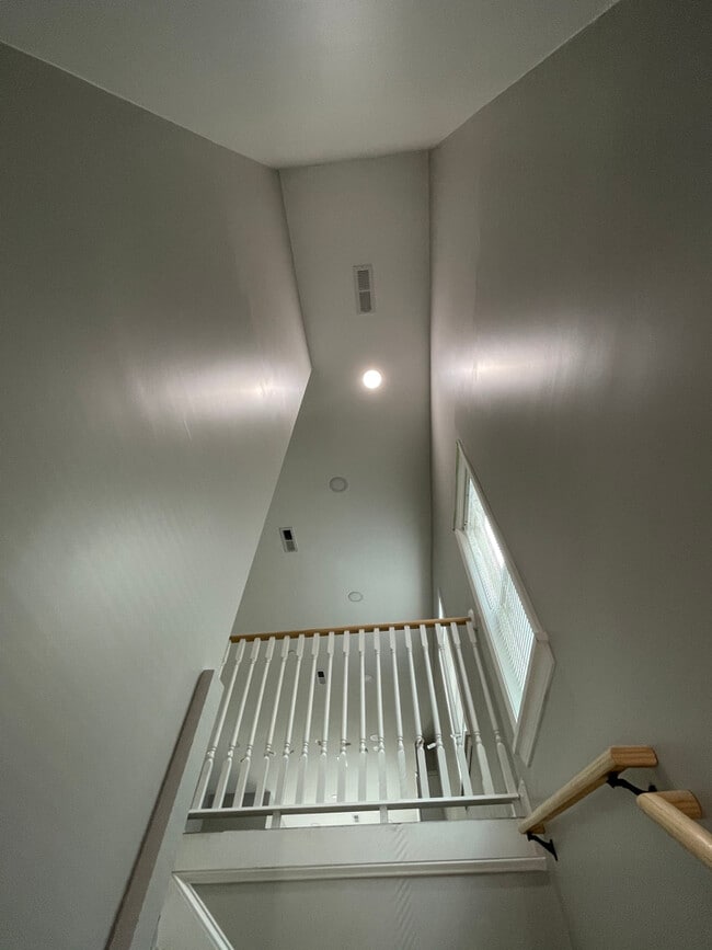 Unit two: staircase after private-entry unit door leading to open-concept floorplan. - 34 Falcon St