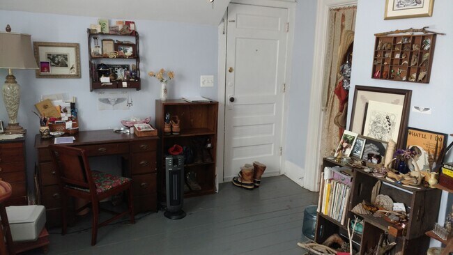 Living room looking toward entry door - 416 N Huron St