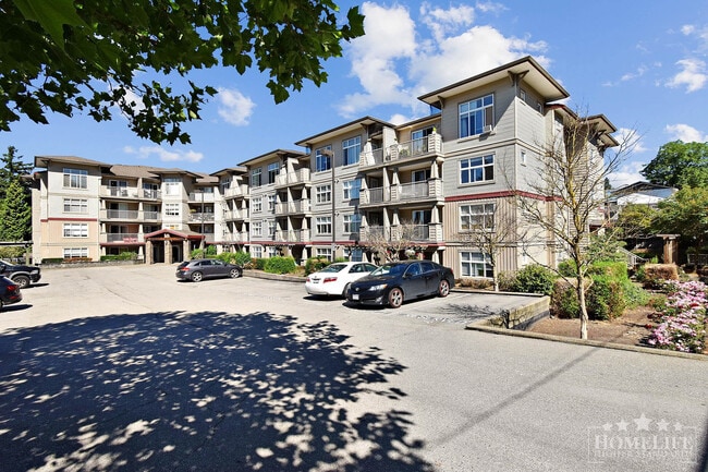Building Photo - Modern 1 Bedroom + Den Condo with Mountain Views in Prime Abbotsford Location