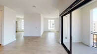 Located at 3405 Third Ave in San Diego, this single-level unit offers a thoughtfully designed open-concept floor plan with generous living space. Light-toned wood-style flooring flows throughout the main living areas, complementing the bright white walls and creating a clean, contemporary aesthetic.

The kitchen is a functional centerpiece, featuring white cabinetry, dark countertops, a patterned tile backsplash, stainless steel appliances — including a refrigerator, range, and dishwasher — and a peninsula with pendant lighting overhead. A dedicated pantry or storage closet is conveniently positioned nearby. The kitchen opens directly to the living area, which is bathed in natural light and connects to a balcony through large black-framed sliding glass doors.

The bedroom is carpeted for comfort and includes a ceiling fan, a window with outdoor views, and access to a spacious walk-in closet outfitted with dual hanging rods and shelving on multiple walls.

The bathroom is well-sized, featuring large-format floor tiles, white cabinetry with dark hardware, a dark-topped vanity, a broad mirror, and a soaking tub with a bold black-and-white patterned tile surround that serves as a striking design focal point.