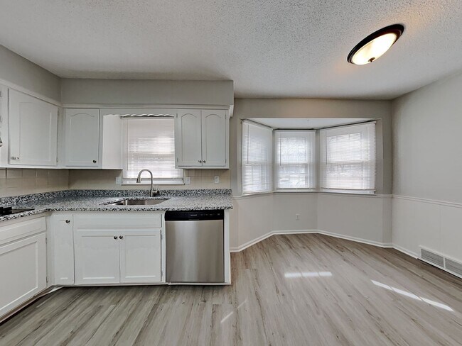 Building Photo - Spacious 4BR Home with Finished Basement, Fireplace & Unique Layout