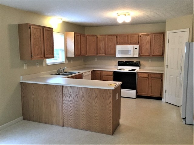 Foto del edificio - 5910 Hidden Oaks Court