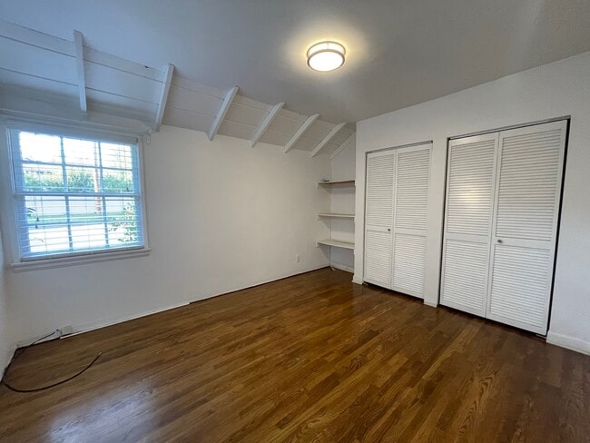 2nd bedroom with pitched ceiling - 900 S Kenneth Rd