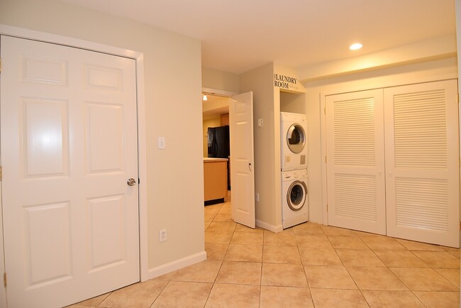 Bedroom with view of washer/dryer stack - 114 12th St NE