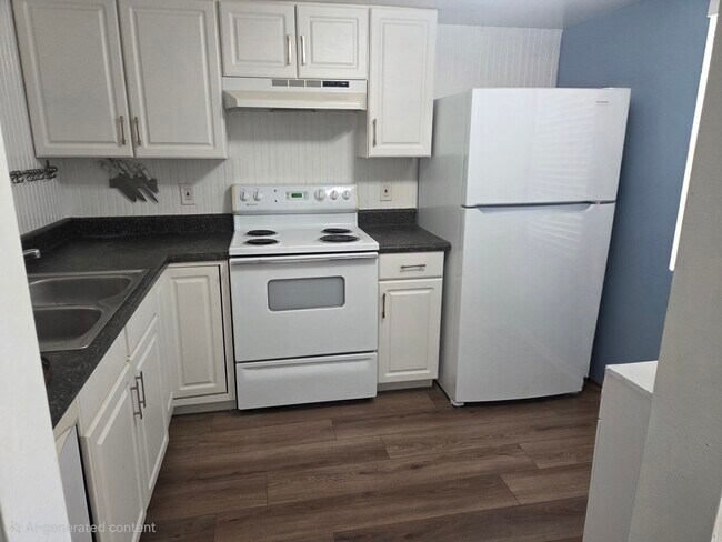 Kitchen with new refrigerator and icemaker - 100 Grand Blvd