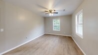Located at 110 Biesecker Road in Lexington, North Carolina, this single-floor, 2-bedroom, 2-bathroom unit offers a functional and comfortable layout. The open-concept kitchen and living area serves as the heart of the home, featuring light wood-style laminate flooring that extends throughout the main living spaces. The kitchen is well-equipped with white cabinetry, dark granite-style countertops, a stainless steel double-basin sink, a dishwasher, electric range, and refrigerator, complemented by a window that brings in natural light and outdoor views. A pendant light adds a subtle decorative touch overhead. Both bedrooms are carpeted and include ceiling fans for year-round comfort. The primary bedroom is a well-proportioned space with two closets and windows offering natural light. The second bedroom also features a ceiling fan and a window with outdoor greenery views. The two bathrooms are clean and functional — one includes a vanity with a dark espresso cabinet, granite-topped sink, and modern fixtures, while the other features a tub-shower combo. A connecting hallway ties the layout together efficiently, making this a well-organized and move-in ready home.