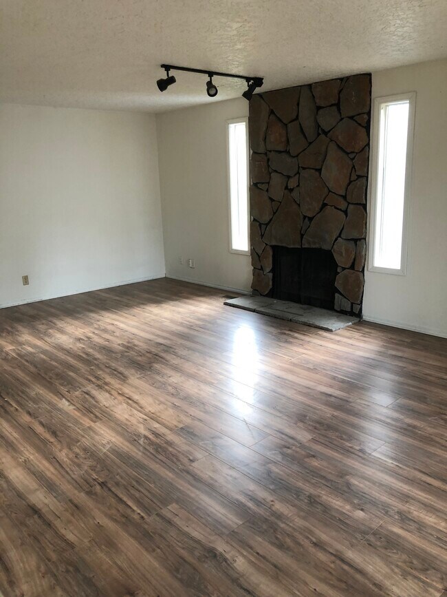Living room with wood burning fireplace - 10405 SE 13th Cir