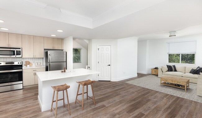 Spacious kitchen with an island that opens up to the living room - City Center on 7th