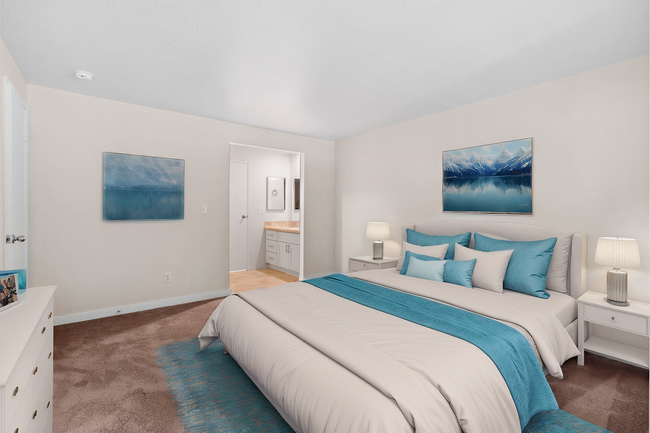 Experience comfort and style in this beautifully designed bedroom, complete with an en-suite bathroom. - Sunset Gardens Apartments