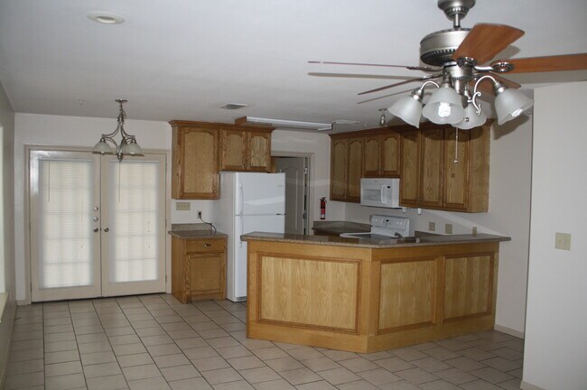 Inside looking at the kitchen area - 1204 West Kiwi