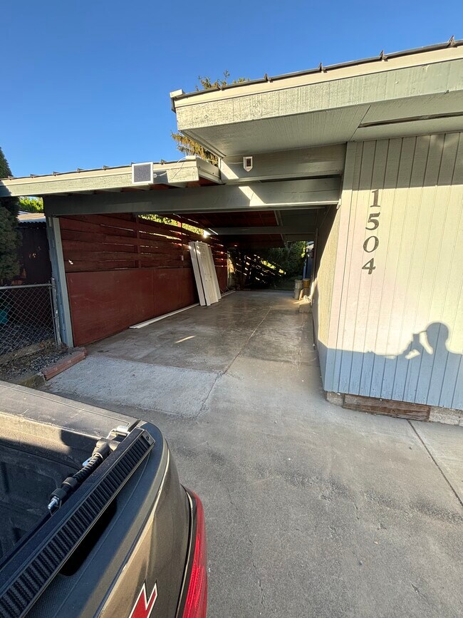 Carport on left side of residence that leads to the shared back yard - 1504 W 7th Pl