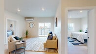 This 780 square foot apartment in Kennewick, WA offers a contemporary living experience with its thoughtful design and modern amenities. The open-concept layout maximizes space and light, creating a seamless flow between the living areas. The living room boasts large sliding glass doors leading to a balcony, flooding the space with natural light and providing outdoor views.

The kitchen is a highlight, featuring a sleek design with contrasting dark lower and white upper cabinets, stainless steel appliances, and ample counter space. A small dining area adjoins the kitchen, perfect for casual meals or work-from-home setups.

The primary bedroom, measuring 170 square feet, offers a spacious retreat with a built-in closet and wall-mounted air conditioning unit for year-round comfort. The second bedroom, while smaller, is versatile and well-lit. Both bedrooms feature light wood flooring and neutral wall colors, creating a bright and airy ambiance.

The bathroom continues the modern aesthetic with a clean design, featuring a tub-shower combination and stylish fixtures. Throughout the apartment, recessed lighting and large windows contribute to the overall bright and inviting atmosphere.

Thoughtful touches like artwork and decorative elements add character to the space, making it feel both stylish and homey. The apartment's efficient use of space and contemporary finishes make it an ideal choice for those seeking a modern urban lifestyle in Kennewick.