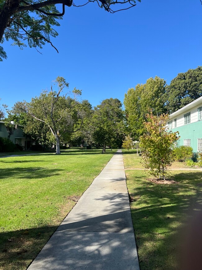 Outdoor grass area - 5458 1/2 Village Grn Townhome
