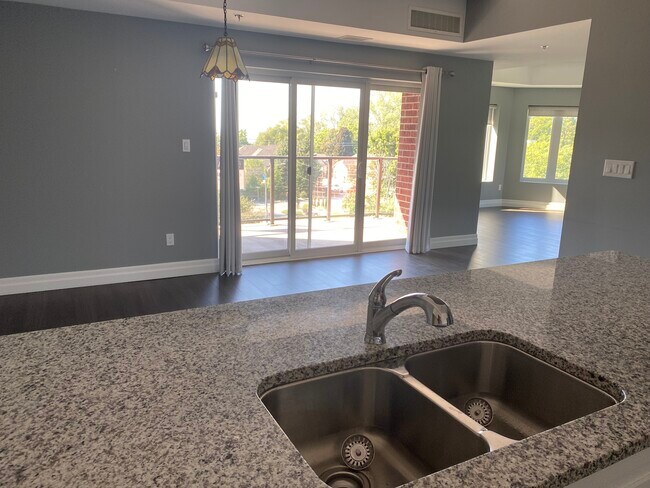 Nice sightlines into dining room and living room with 4 large windows. - 6 Park St