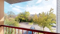 Located at 2332 Asics Dr in Hilliard, Ohio, this single-floor space offers a comfortable and functional layout well-suited to everyday living. One of the property's notable features is its private balcony, which provides an elevated outdoor retreat with views of mature trees and the surrounding neighborhood. The balcony is equipped with a sturdy railing and offers a pleasant vantage point overlooking the tree-lined parking area and neighboring rooftops, creating a sense of greenery and openness. The natural surroundings, particularly during the autumn season, lend the outdoor space a scenic, tranquil quality. The setting within the Hilliard community places the property conveniently close to local amenities, schools, and thoroughfares that characterize this established Columbus suburb. While interior images were limited, the single-floor configuration suggests a straightforward, accessible layout that minimizes the need to navigate between levels. Overall, the space offers a practical living environment complemented by an inviting outdoor area and a location within a well-maintained residential community in Hilliard, OH.