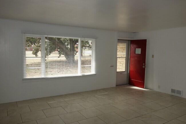 Living room with large window - 5527 E 5th St