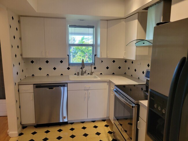 kitchen window looking out to pool - 215 NE 16th Ave