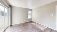 Located at 1301 Sycamore School Rd in Fort Worth, TX, this one-bedroom, one-bathroom unit offers a well-organized single-floor layout designed for efficient, comfortable living. Throughout the space, wood-look vinyl plank flooring runs consistently, complemented by neutral warm-gray walls, white trim, and textured ceilings that create a clean, cohesive aesthetic.

The living area provides an open, flexible space with a built-in shelf niche and a ventilation panel, connecting seamlessly to the rest of the unit. The galley-style kitchen is thoughtfully equipped with white cabinetry featuring brushed nickel hardware, white countertops, a stainless steel sink, and black appliances including an electric range, overhead hood, refrigerator, and dishwasher — maximizing functionality within a compact footprint.

The bedroom is a comfortable, well-proportioned retreat featuring a ceiling fan with light fixture, a window with blinds that invites natural light, and access to a dedicated closet. The full bathroom includes a white vanity with a cultured marble countertop, brushed nickel faucet hardware, a large wall mirror with overhead lighting, and a tub-shower combination. Clean white cabinetry and neutral tones maintain a bright, tidy atmosphere throughout the bathroom.