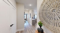 Located at 2237 Riley Fuzzel Rd in Spring, TX, this thoughtfully designed single-story home offers 2 bedrooms, 3 bathrooms, an office, and a dedicated dining room within a efficiently organized floor plan. Wood-look flooring flows throughout the main living areas, complementing a neutral color palette that lends the space a clean, contemporary feel. The kitchen is outfitted with stainless steel appliances, light two-tone cabinetry, white quartz countertops, subway tile backsplash, and built-in open shelving—ideal for both cooking and display. The dining room features abundant natural light through large windows and a glass-panel door, creating a bright, airy atmosphere. The primary bedroom is a comfortable retreat with a ceiling fan, large window with garden views, and access to a walk-in closet. Its ensuite bathroom is finished with marble-look tile flooring, a glass-enclosed shower with black hardware, and a double vanity with quartz countertops. The second bedroom is bright and well-sized, with a dedicated closet nearby. The office provides a versatile flex space with natural light. Three full bathrooms ensure convenience for residents and guests. A dedicated laundry room houses a full-size washer and dryer. The home combines functional layout with modern finishes throughout.