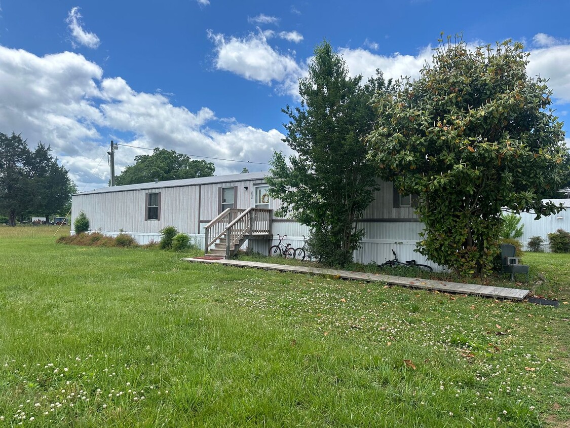 Primary Photo - Single wide located in the country. Lots o...