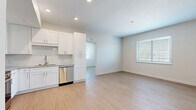 Located at 920 Manatee Ave W in Bradenton, Florida, this thoughtfully designed 2-bedroom, 2-bathroom residence offers a clean, modern aesthetic across a single-floor layout. Light wood-look flooring flows throughout the space, complementing the bright, neutral palette found in every room.

The kitchen is a standout feature, outfitted with white shaker cabinetry, granite countertops, a light blue subway tile backsplash, and a full suite of stainless steel appliances including a refrigerator, range, microwave, and dishwasher. The kitchen opens to a spacious living area bathed in natural light from window treatments with horizontal blinds.

Both bedrooms are well-proportioned and bright, each featuring light flooring, ceiling fans or ventilation, and generous closet space. The primary bedroom includes a dedicated walk-in closet with wire shelving, while the second bedroom features a louvered bifold closet.

The two bathrooms are finished with elegant marble-look tile flooring and matching wall surrounds. White shaker vanities with granite countertops and brushed gold hardware add a refined touch. One bathroom features a tub-shower combination, while the other offers a walk-in shower. Together, these spaces deliver a cohesive, move-in-ready residence with quality finishes throughout.