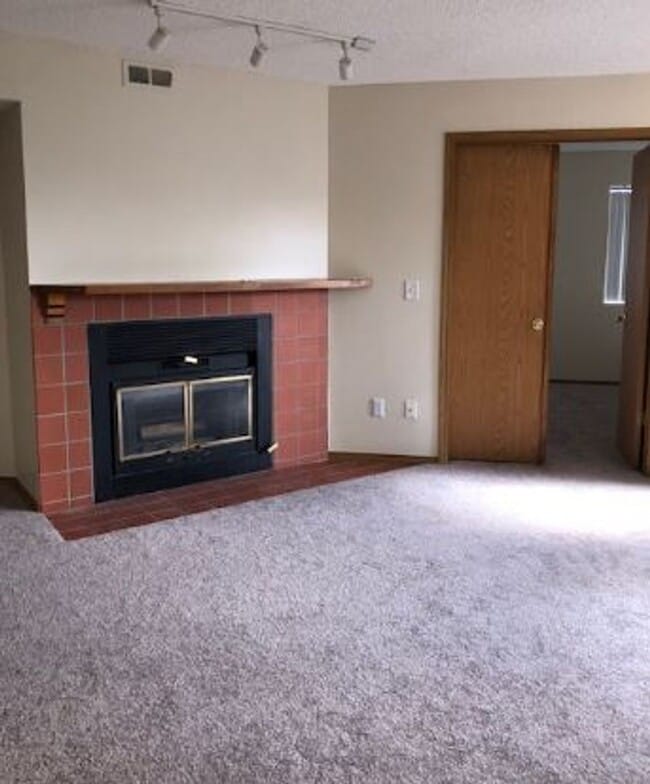 Photo - 2 BR/1BA | Newly Renovated Unit | Front Patio| Fireplace in living room! House