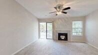 Located at 4199 Green Arbors Ln in Cincinnati, Ohio, this single-floor, 2-bedroom, 2-bathroom residence offers a well-organized layout across a comfortably sized floor plan. The living area serves as the centerpiece of the home, featuring a tile-surround fireplace, vaulted ceiling with a ceiling fan, and a sliding glass door that opens to a private balcony with outdoor views. Natural light fills the space through multiple windows, lending a bright and airy atmosphere throughout.

The kitchen is efficiently designed with white shaker cabinetry, granite-style countertops, a subway tile backsplash, wood-look flooring, and stainless steel appliances. It connects directly to a dedicated laundry room equipped with a full-size washer and dryer. An adjacent dining area features vaulted ceilings and a chandelier overhead.

The primary bedroom offers carpeted flooring, a closet, and direct access to a private bathroom. A spacious walk-in closet with built-in wire shelving provides ample storage. The second bedroom includes a window with natural light and carpeted floors. Both bathrooms are finished with wood-look flooring, granite-style vanities, and tiled tub-shower combinations with brushed nickel fixtures.