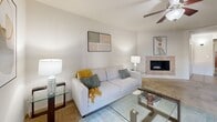 Located at 1150 North El Dorado Place in Tucson, AZ, this well-appointed 2-bedroom, 2-bathroom single-floor residence offers a thoughtfully designed layout across a comfortable footprint. The living room serves as the heart of the home, anchored by a tile-surround corner fireplace and ceiling fan, creating a warm and inviting atmosphere. Adjacent to the living area, the dining room features a distinctive tray ceiling with a pendant light fixture, adding an elegant architectural touch.

The kitchen is outfitted with warm wood cabinetry, granite-style countertops, black appliances including a range, microwave, and refrigerator, and durable tile flooring — offering both style and functionality. Both bedrooms are carpeted and include ceiling fans, with the generously sized primary bedroom providing ample space for large furnishings. The second bedroom also benefits from natural light through window blinds and a built-in closet.

Each bathroom is finished with granite-topped wood vanities, tile flooring, and mosaic-tiled tub and shower surrounds — one featuring a soaking tub and the other a walk-in shower. Hallways connect the rooms seamlessly, contributing to the efficient and comfortable flow of this Tucson residence.