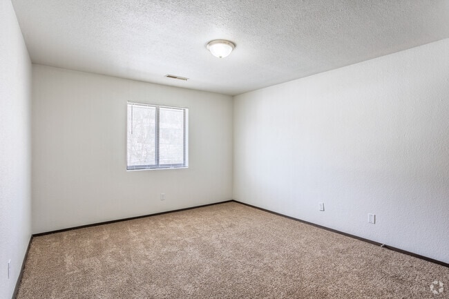 2BR, 1BA - 873SF - Primary Bedroom - Hawkeye Apartments