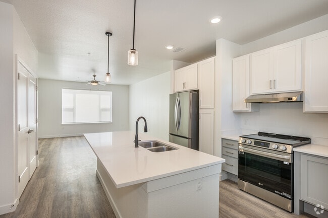 3BR, 2BA - 1,230SF - Kitchen / Living Room - Pine Ridge Crossings