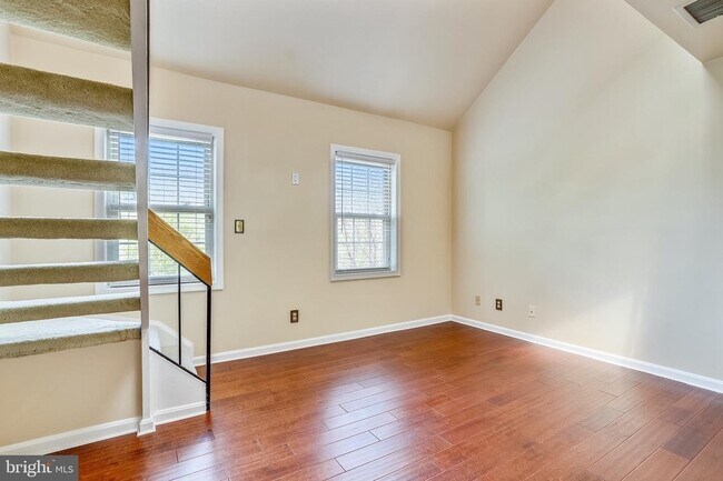 Spacious living room with double-height ceiling. - 1415 E Abingdon Dr