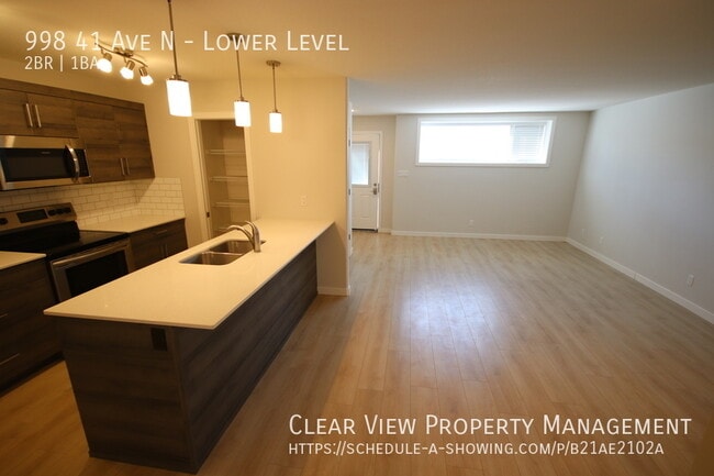 Building Photo - Amazing 2-bedroom suite with zero-scaped i...