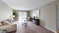 Located at 351 Andover Dr in Valparaiso, Indiana, this single-floor, three-bedroom, one-bathroom home offers a practical and comfortable layout with neutral tones throughout. The carpeted living room is bright and welcoming, featuring a sliding glass door that fills the space with natural light and provides outdoor access. Adjacent to the living room, the dining area stands out with elegant white wainscoting panels and warm hardwood flooring, lending a classic, polished character to the space. The kitchen is well-equipped with ample cabinetry, dark laminate countertops, and a full range, offering efficient use of the available space. The spacious primary bedroom features plush carpet, a large louvered bi-fold closet, and a dedicated walk-in closet, providing generous storage. The additional bedrooms are carpeted and include window treatments that allow for natural light. A shared full bathroom with a tub-shower combination and hardwood flooring serves the home. A connecting hallway ties all rooms together efficiently. With two closets throughout the home and a cohesive neutral color palette, this residence offers a tidy and functional living environment well-suited for everyday comfort.