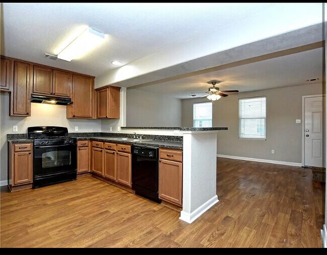 Kitchen looking over to Den - 220 Trestle Tree