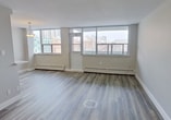 This contemporary 58 square meter (624 sq ft) apartment, located at 706 - 345 Merton St in Toronto, offers a thoughtfully designed living space. The one-bedroom unit showcases an open-concept layout, maximizing the use of space and creating a sense of airiness.

The living area is bathed in natural light, thanks to expansive windows that offer stunning views of the Toronto cityscape. These windows not only brighten the space but also provide a connection to the urban environment beyond. The room features modern wood-look flooring, adding warmth and durability to the space.

The kitchen is a highlight, boasting sleek white cabinetry, marble-look backsplash, and stainless steel appliances. It's equipped with ample storage and counter space, making it both functional and aesthetically pleasing. The bathroom continues the modern theme with large format marble-look tiles and a combination tub-shower unit.

The bedroom, measuring 14 square meters, offers a tranquil retreat with large windows and the same contemporary flooring found throughout the apartment. Built-in closets provide valuable storage space.

Throughout the apartment, baseboard heating ensures comfort in all seasons. The neutral color palette and clean lines create a canvas ready for personalization, while the overall design speaks to a modern, urban lifestyle.