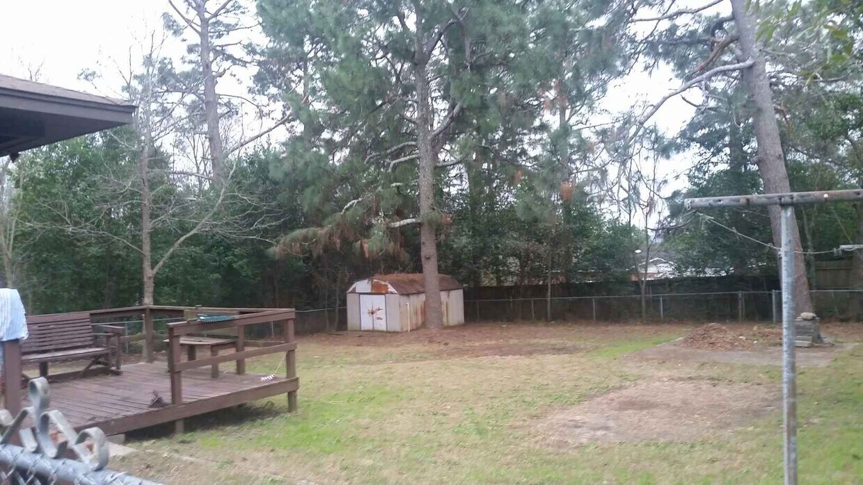 Fenced Backyard with large deck and cement pad for firepit or grill - 3409 Westmont Dr