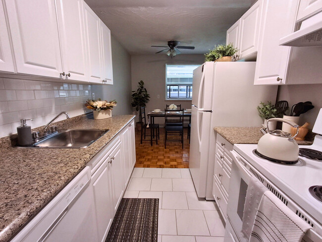 Ample Kitchen Storage with Dishwasher, Fridge & Stove - The Diplomat Apartments