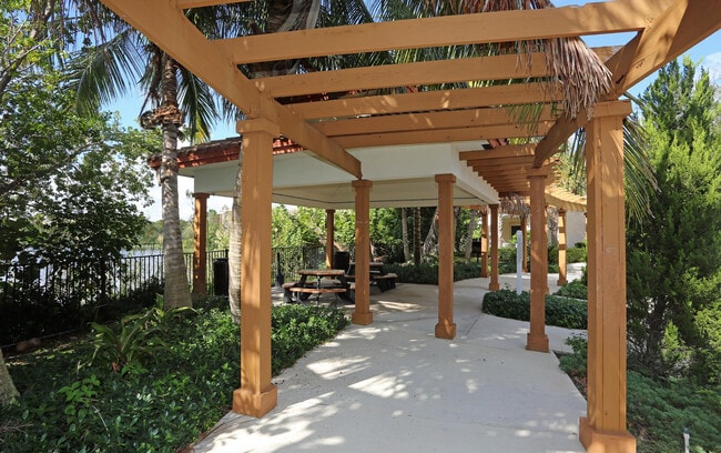 Relax or gather with friends at our serene lakeside pavilion. - Bridgewater at Lake Osborne