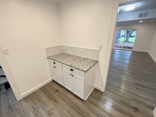 A small buffet area gives the kitchen extra counter space. - 14553 Old Courthouse Way