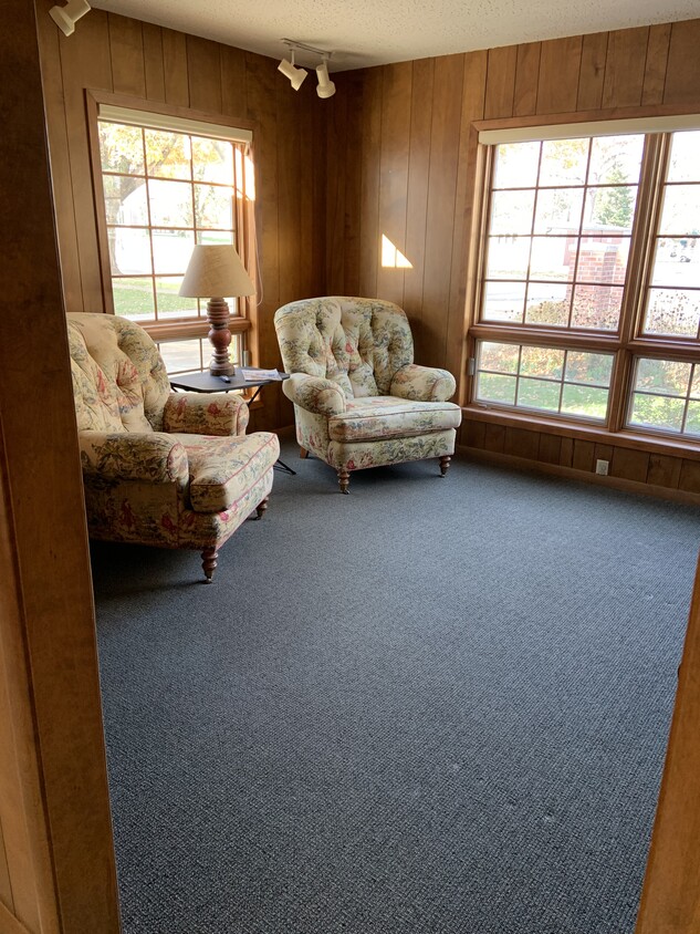 Cozy living room with large windows - 111 W Main St