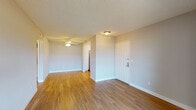 Located at 848 Webber Cir in Ventura, California, this single-floor residence offers a thoughtfully arranged layout with a clean, neutral aesthetic throughout. The main living area welcomes you through a paneled front door and features warm wood-style flooring, soft gray walls, and a textured ceiling. A ceiling fan provides added comfort, while an open passageway connects the living space to the rest of the unit seamlessly.

The kitchen is well-equipped with white cabinetry offering ample storage, light countertops, a gas range, an over-the-range microwave, and a stainless steel sink — providing a functional and tidy cooking environment.

The bedroom is carpeted for comfort and includes a walk-in closet, offering generous storage. The room connects conveniently to the rest of the unit and is bathed in a calm, neutral tone. The bathroom is clean and practical, featuring a full tub and shower combo, a toilet, a wide vanity with a large mirror, and bright overhead lighting.

A standout feature is the sliding glass door that opens to a private balcony, flooding the adjacent room with natural light and providing pleasant outdoor views of the surrounding greenery — a welcome touch of the Southern California lifestyle this Ventura location has to offer.