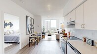 Located at 2 River Plate Street in Ajax, Ontario, this thoughtfully designed one-bedroom, one-bathroom unit offers a efficient and modern living experience across a single floor. The open-concept kitchen and living area forms the heart of the space, featuring light hardwood-style flooring, crisp white walls, and abundant natural light. The kitchen is well-appointed with white flat-panel cabinetry, a subway tile backsplash, stainless steel appliances including a dishwasher and electric range, and ample counter space. The living area is bright and inviting, highlighted by large floor-to-ceiling windows that frame expansive city and greenery views, creating a seamless connection to the outdoors. A private balcony extends the living space further, offering additional outdoor access. The bedroom features generous sliding-door closet storage, large windows with sweeping urban views, and light wood flooring, creating a calm and airy retreat. The bathroom is finished with clean white tile surrounding a full soaker tub and shower combination, complemented by neutral tile flooring. Throughout the unit, the consistent use of white tones, contemporary fixtures, and natural light gives the space a clean, modern ambiance ideal for comfortable urban living.