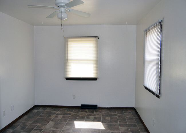 Bedroom two with lighted closet and door to fenced backyard. - 224 4th St E