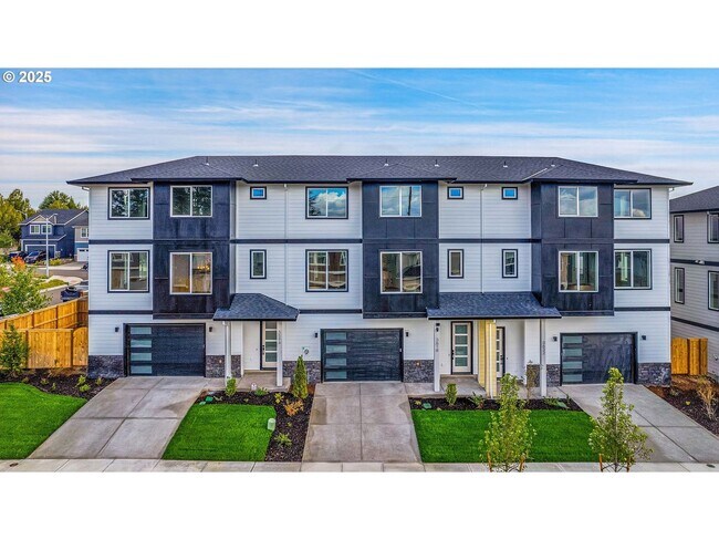 Foto del edificio - Newly Built Modern Open-Concept Condo with Island Kitchen, Granite Counters and a Deck