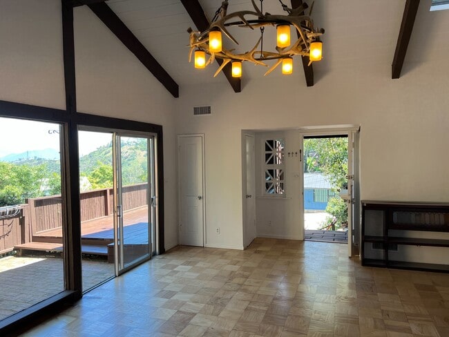 Front door and deck from living room. - 2021 Rosilla Pl