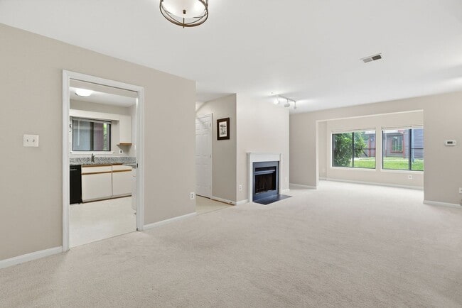 Building Photo - Contemporary design meets exceptional space in this inviting ground level residence, offering eff...