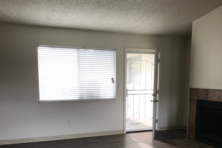 Living room: new paint/windows/blinds/flooro - 9407 Westmora Ct