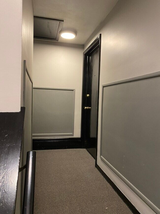 Newly painted and carpeted hallway - 6062 Transit Rd